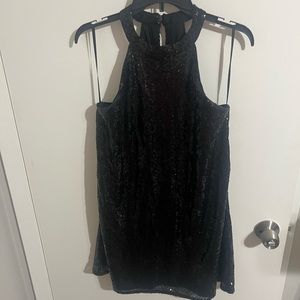 Black sequin halter top mini dress.   Above the knee but not too short.  NWT